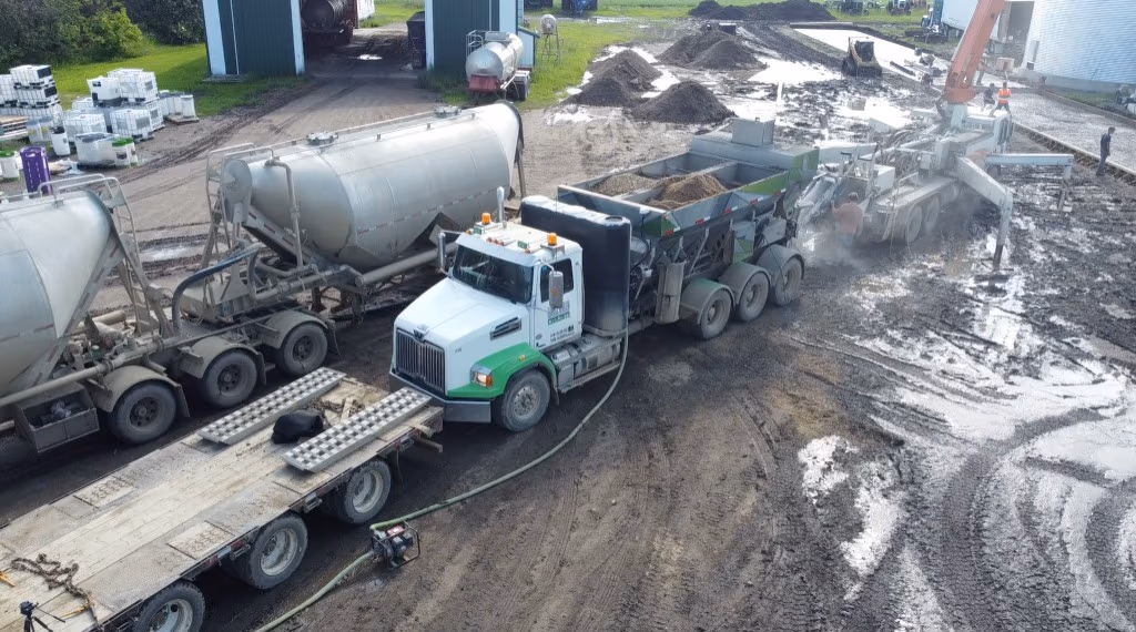 Concrete Genius Omni Mixer operating on site with support trucks