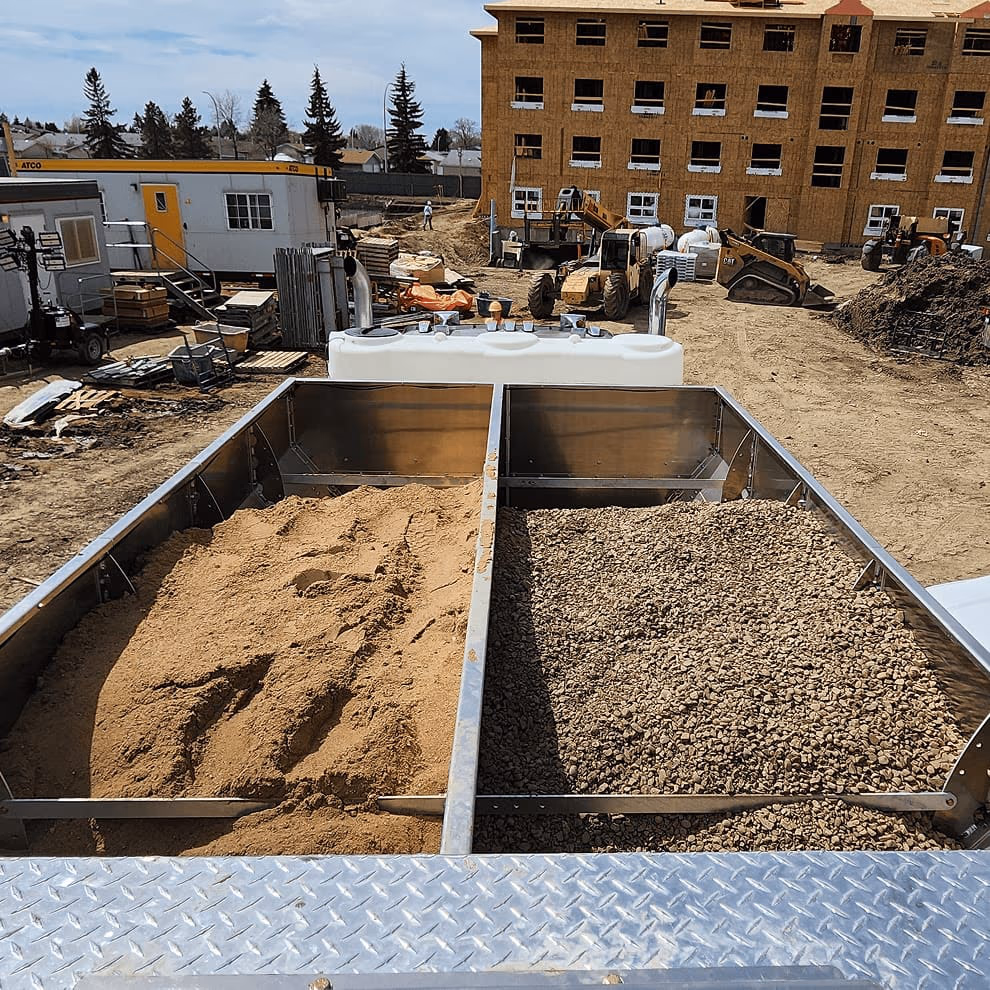 OMNI mixer aggregate hoppers on job site